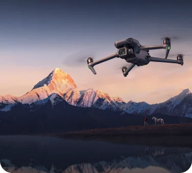 Camera drone flying above a mountain landscape